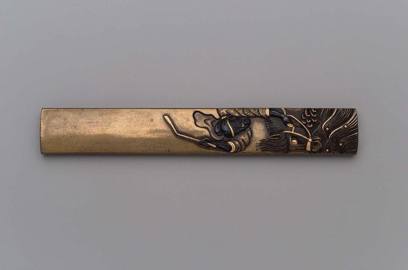 Kozuka with design of Gentoku urging on his horse