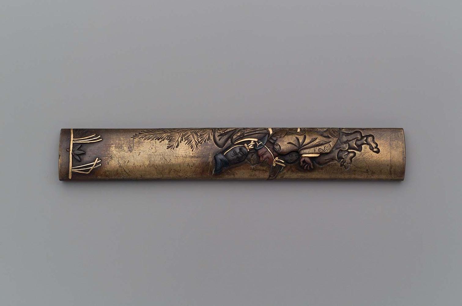 Kozuka with design of two dancing Shinto priests at a Shrine