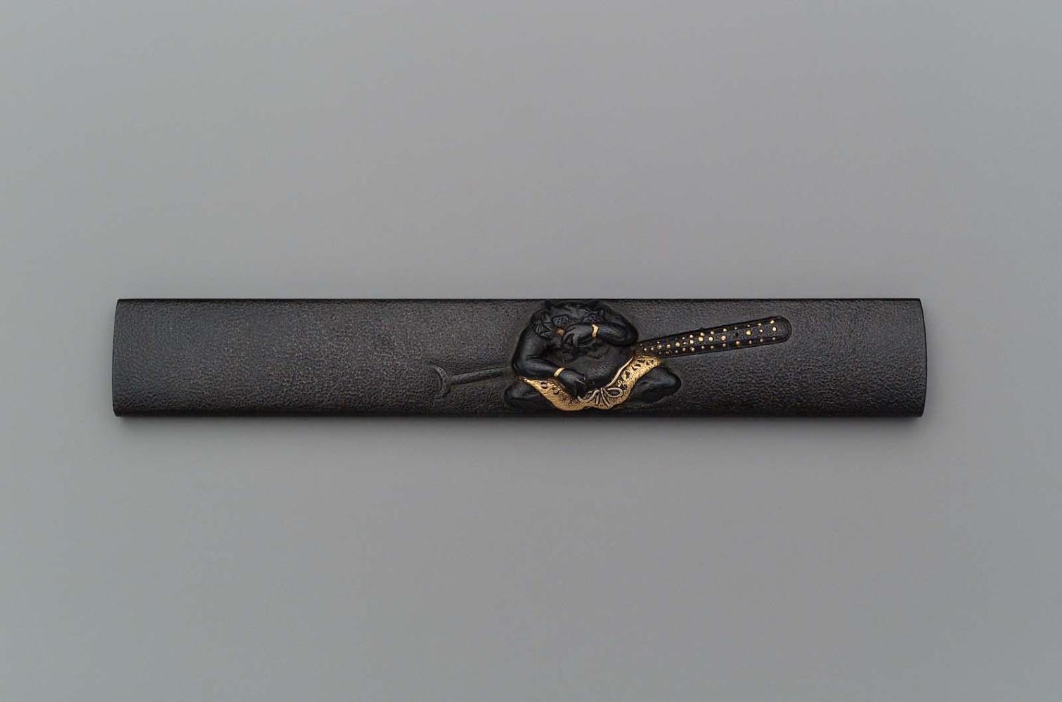 Kozuka with design of oni and Shoki's stave