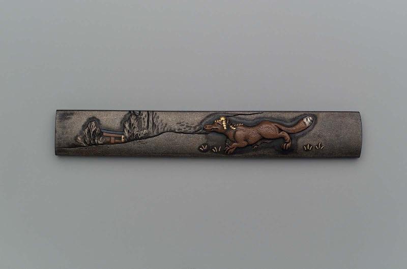 Kozuka with design of magic fox approaching a Shinto shrine