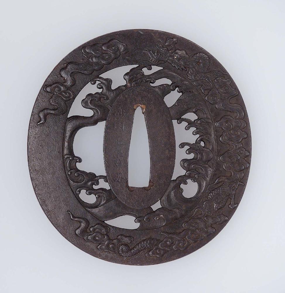 Tsuba with design of dragons, waves and clouds