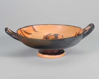 Drinking cup (kylix) depicting Herakles wrestling the Nemean lion