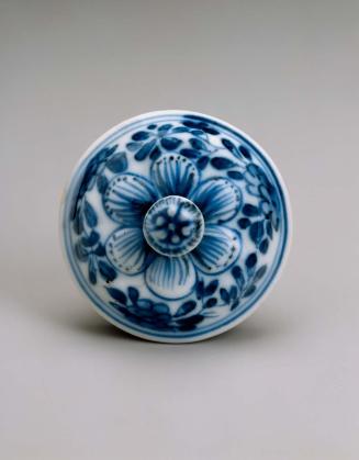 Double-spouted melon-shaped ewer with blue-and-white decoration of flower scrolls
