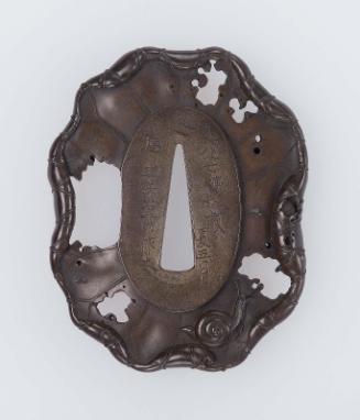 Tsuba in the form of a decaying lotus leaf, and a snail