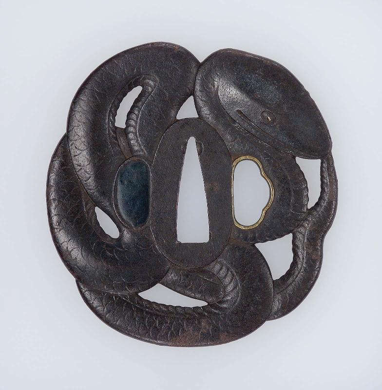 Tsuba in the form of a snake coiled around the seppadai