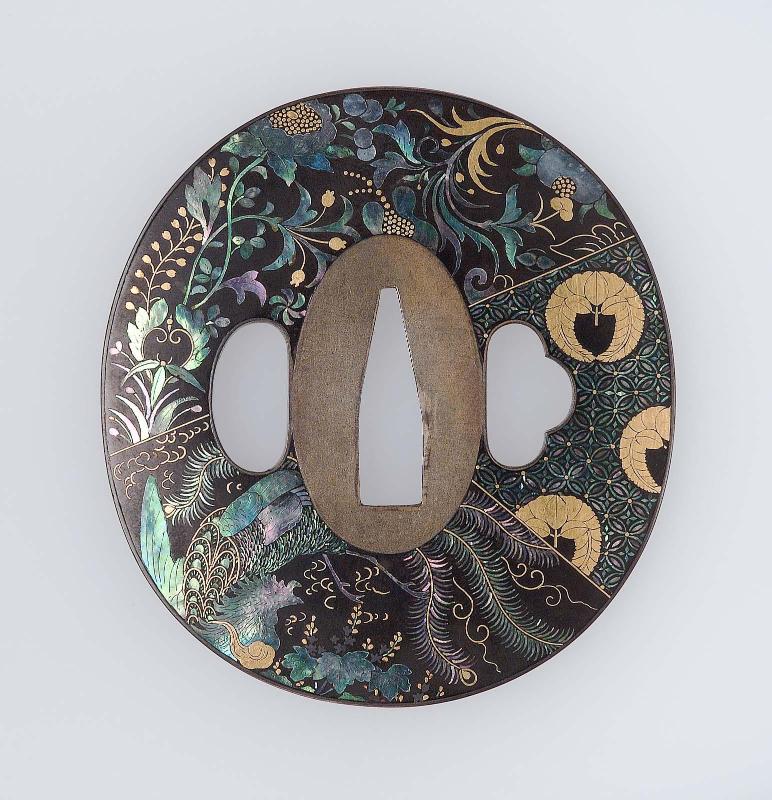 Tsuba with design of ho-o bird, wisteria mon and various geometric and floral patterns