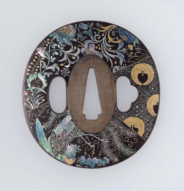 Tsuba with design of ho-o bird, wisteria mon and various geometric and floral patterns