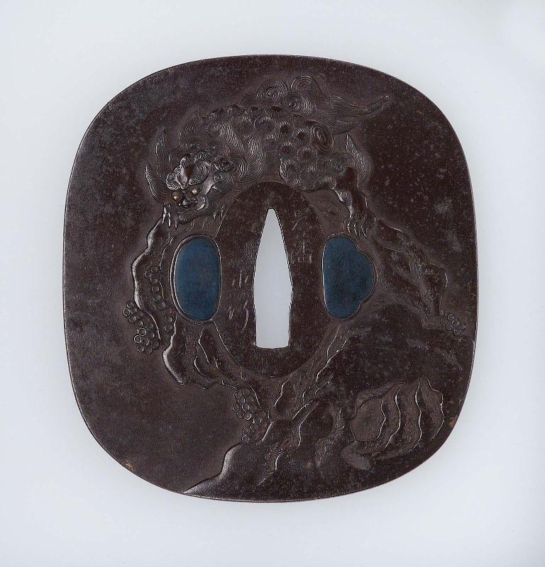 Tsuba with design of shishi on a crag