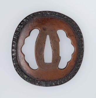Tsuba with namazu piercings and applied rim modeled as an octopus tentacle