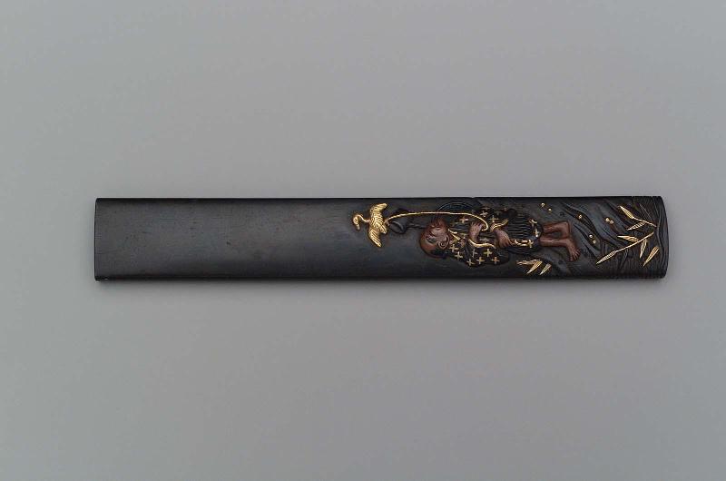 Kozuka with design of fisherman on land with his cormorant