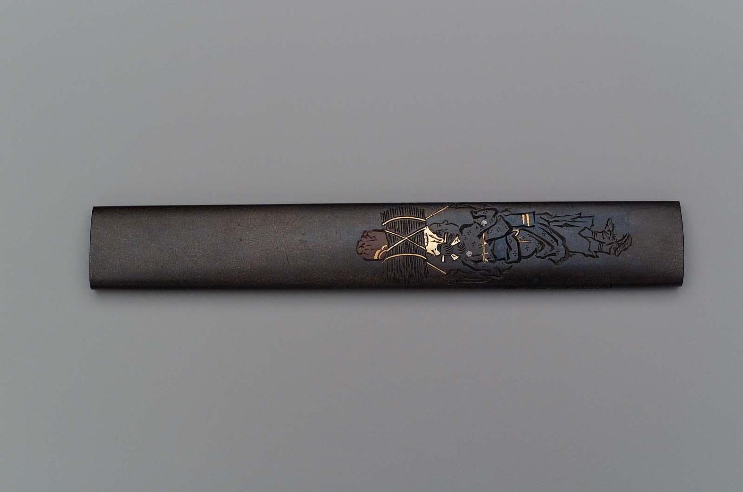 Kozuka with design of Oharame carrying a bundle of wood