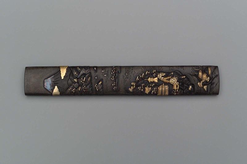 Kozuka with design of a landscape with Mount Fuji, sailboats, pines and buildings