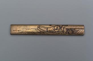 Kozuka with design of Hotei in a boat playing the shakuhachi