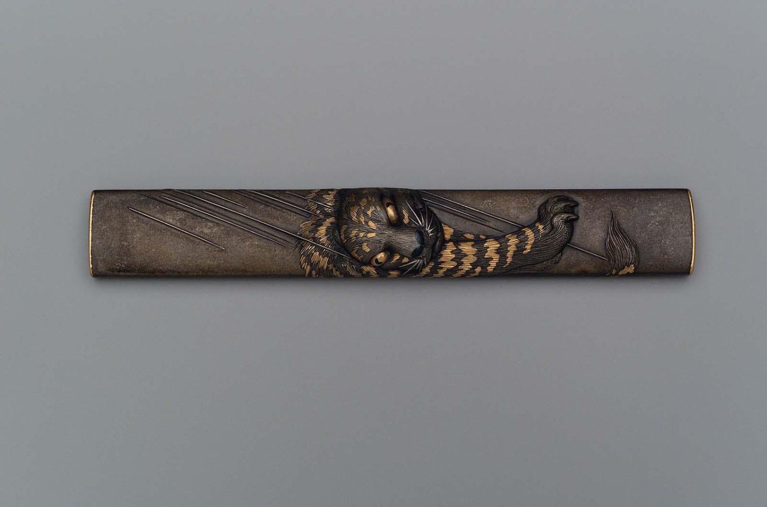 Kozuka with design of a tiger in the rain