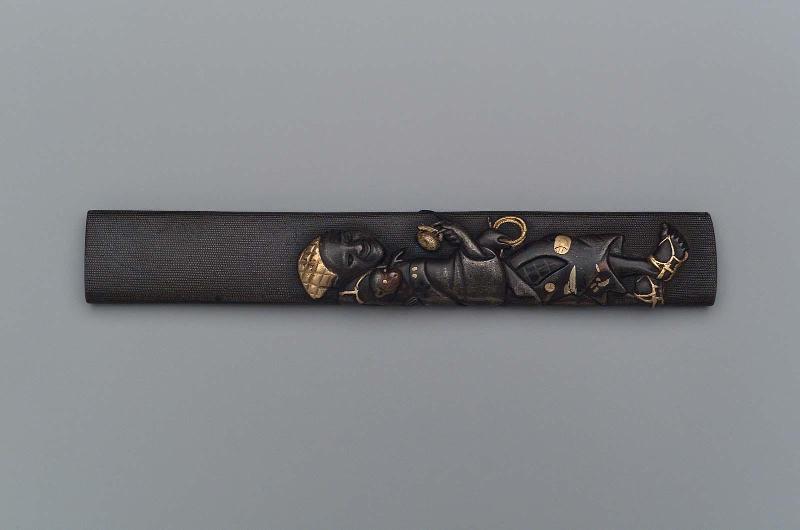Kozuka with design of a monkey-trainer