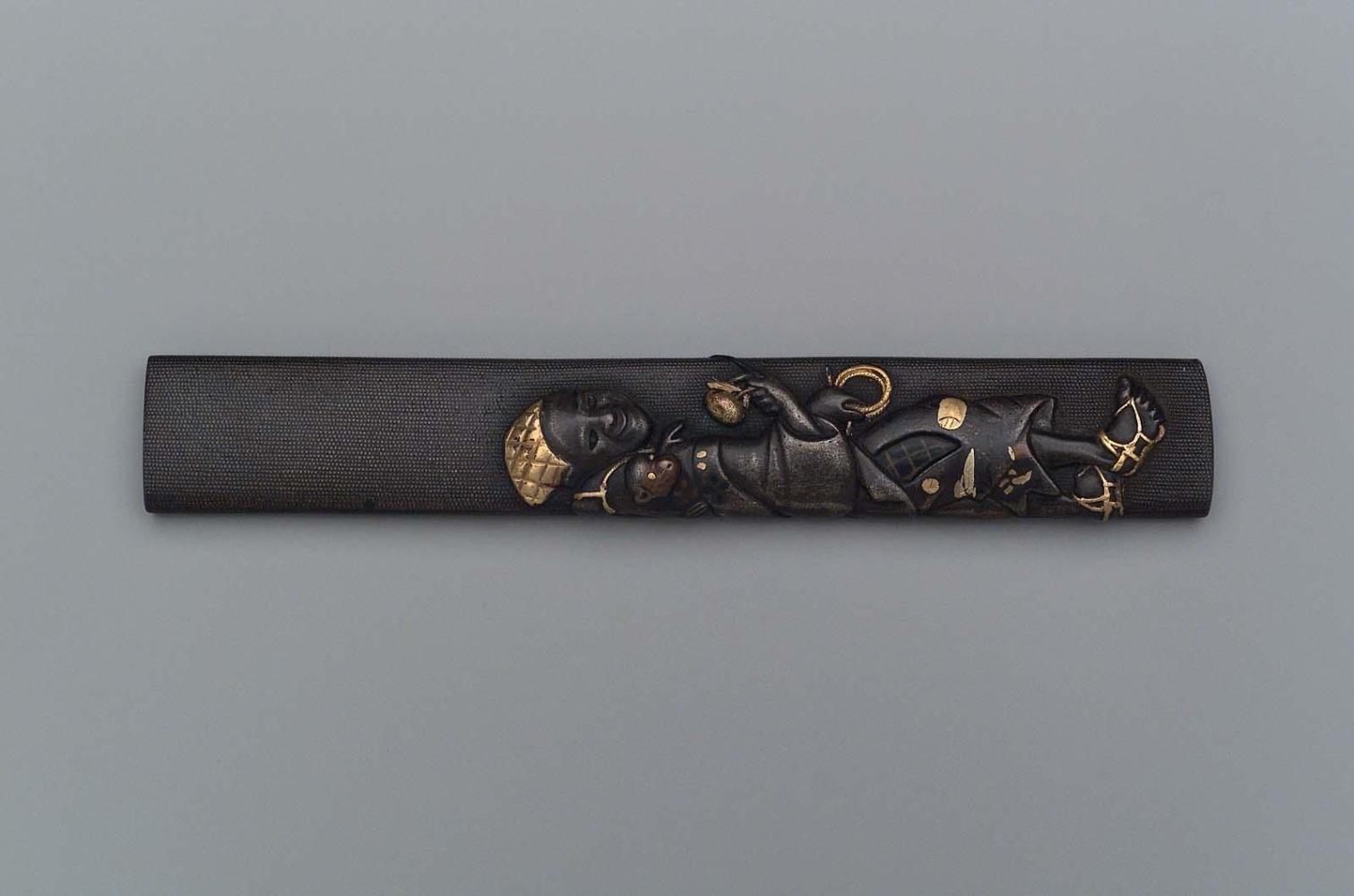 Kozuka with design of a monkey-trainer