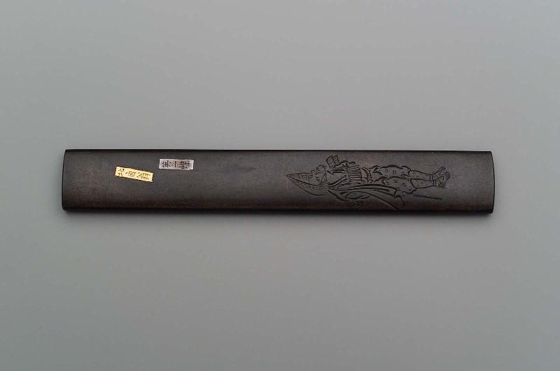 Kozuka with design of standing figure