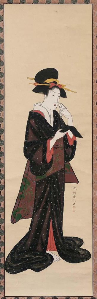 Woman Looking at Herself in a Hand-Mirror