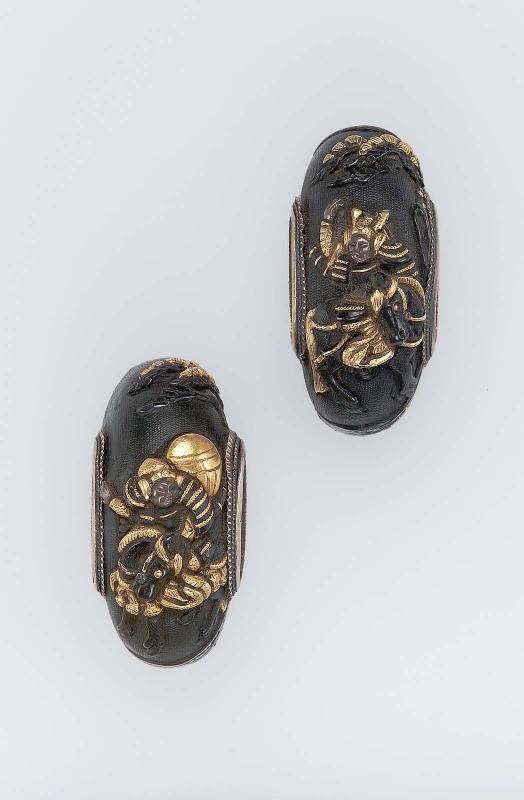 Two kojiri with designs of mounted warriors