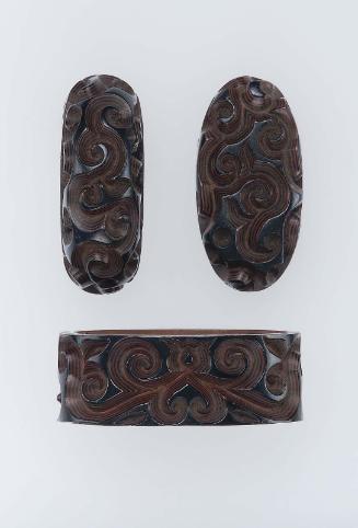Fuchi-kashira and kojiri with designs of guri scrolls