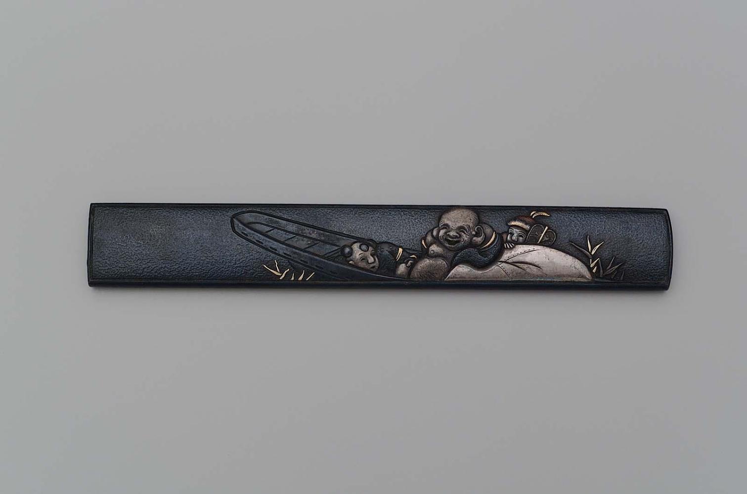 Kozuka with design of Hotei in a boat with two Chinese boys