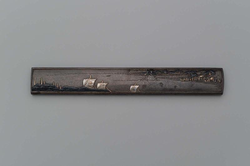 Kozuka with design of sailboats, pines, masts, castle wall and  look-out tower (yagura)