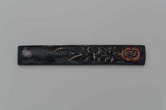 Kozuka with design of susuki and ominaeshi in a Bizen-ware container