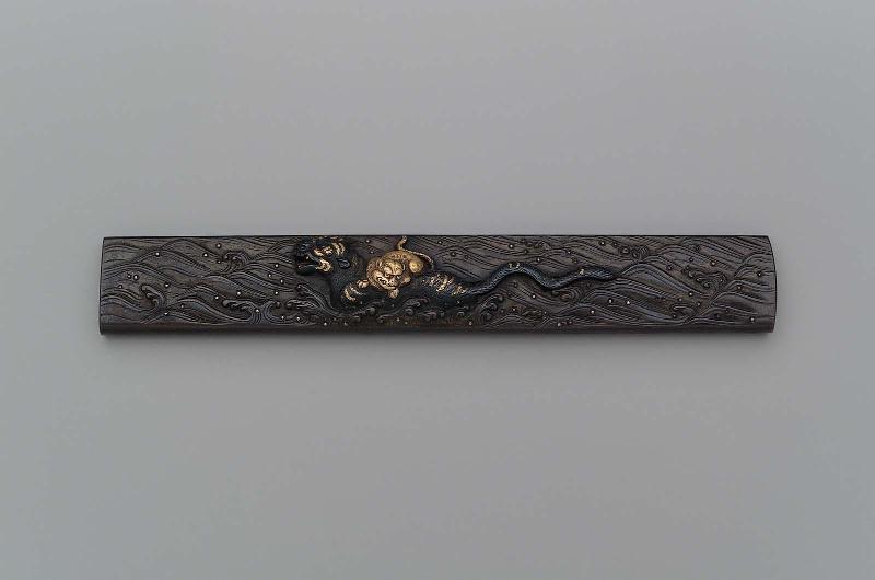 Kozuka with design of a tiger with a cub on its back swimming across a river
