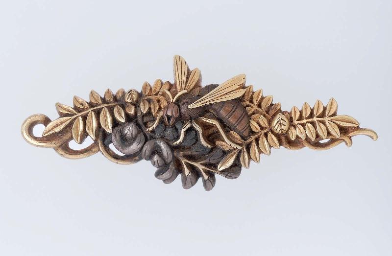 Menuki in the form of a wasp on a flowering branch
