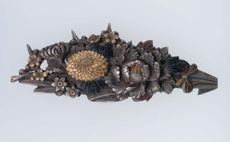 Menuki in the form of a spray of chrysanthemums, peonies and other flowers