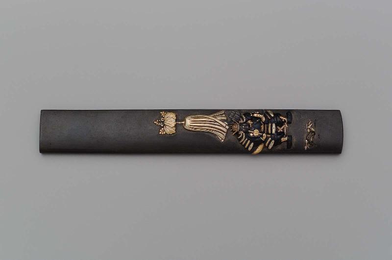 Kozuka with design of seated general with banner