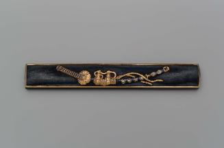 Kozuka with design of a mounted slung sword (tachi)