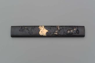 Kozuka with design of boy with a lion mask