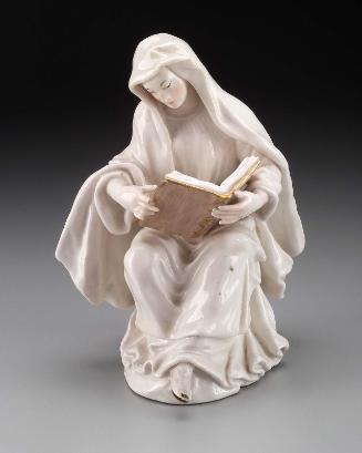 Figure of a young Nun seated
