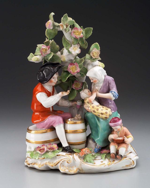 Man, woman, and child under flowered tree