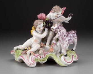 Two putti and a goat with grapes