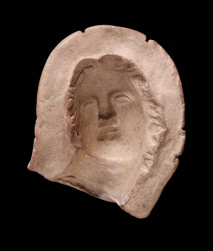 Mould of the face of a woman, possibly Aphrodite