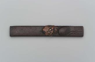 Kozuka with design of Daruma irritated by an insect on his head