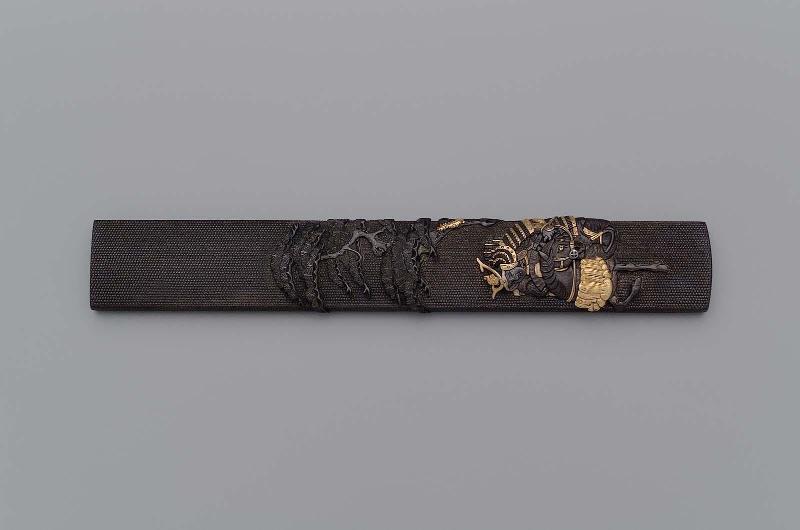 Kozuka with design of mounted samurai under a pine tree