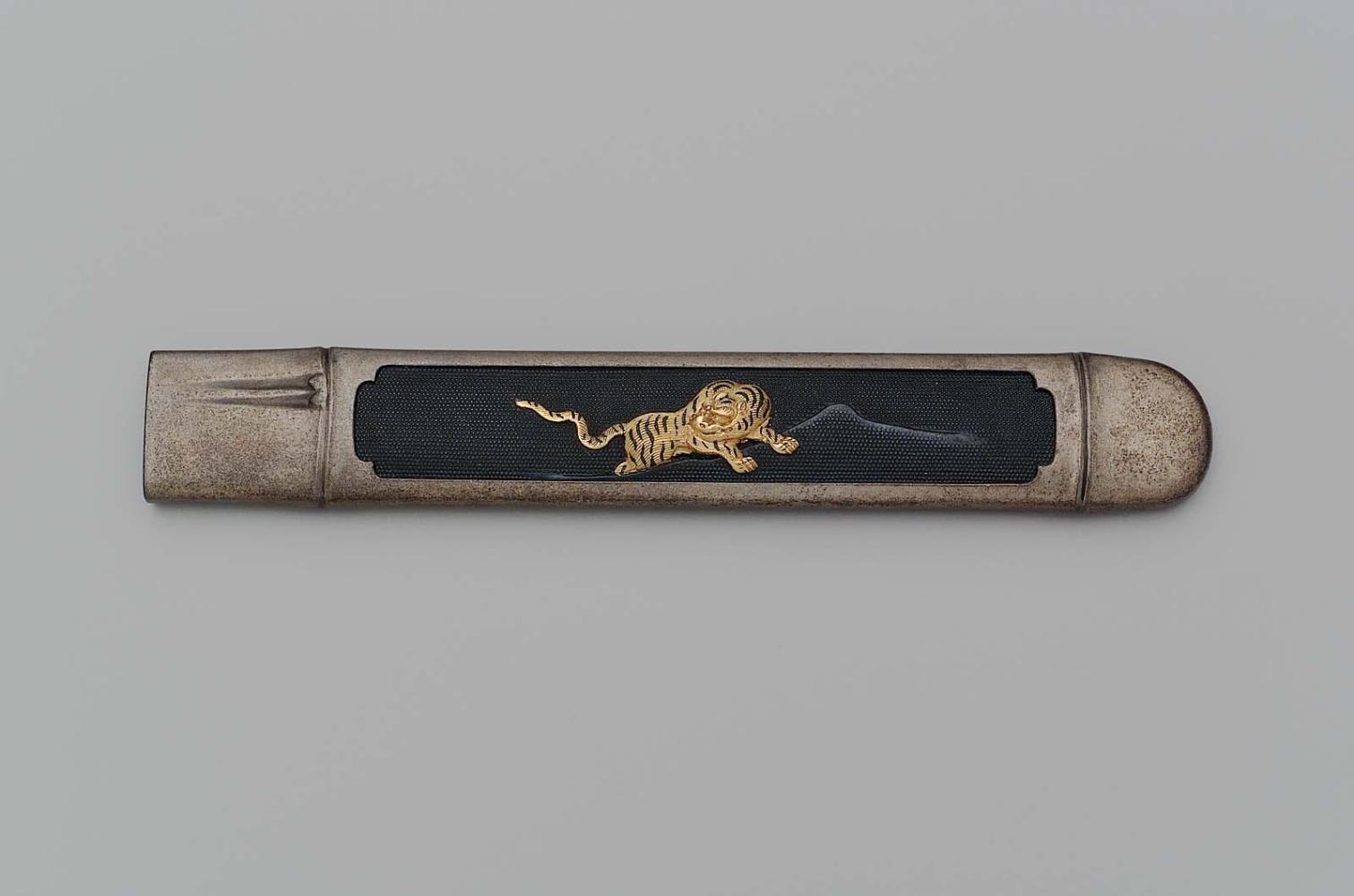 Kozuka with design of a tiger within a frame simulating bamboo