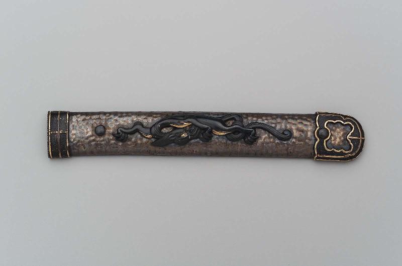 Kozuka in the form of a sword handle with menuki in the form of a dragon