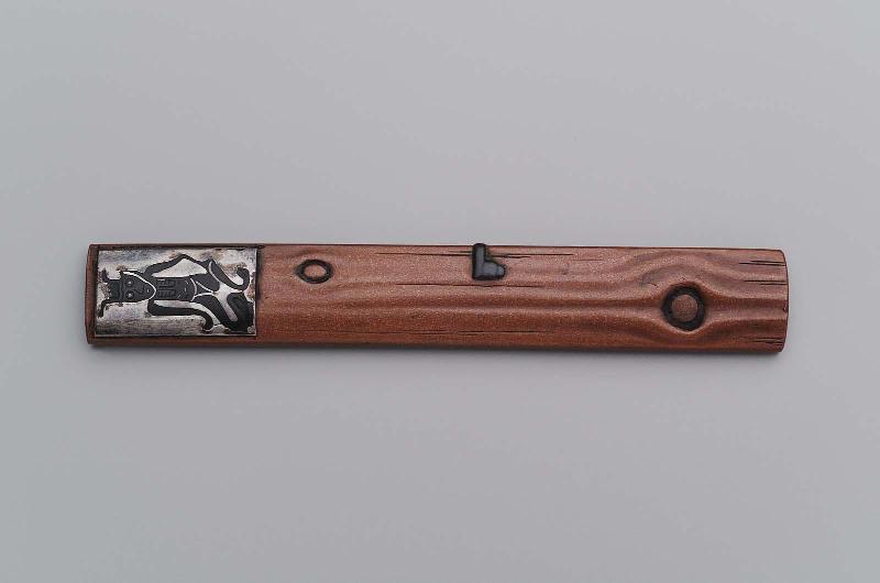 Kozuka with design of an Otsu-e hanging on a pillar