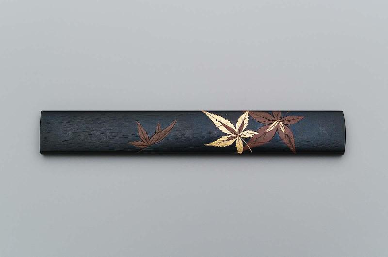 Blade with design of stylized birds