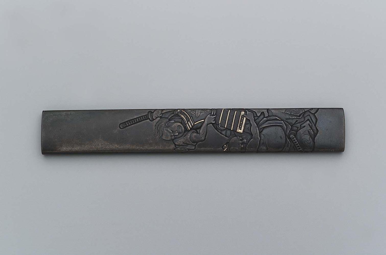 Kozuka with design of Asahina Saburo pulling Soga no Goro's armor