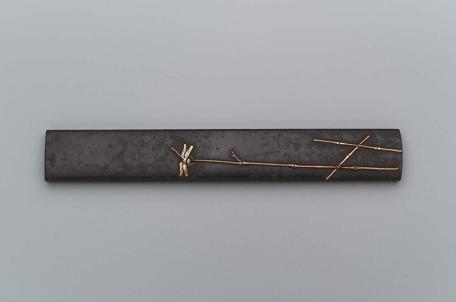 Kozuka with design of dragonfly landing on a stem of bamboo