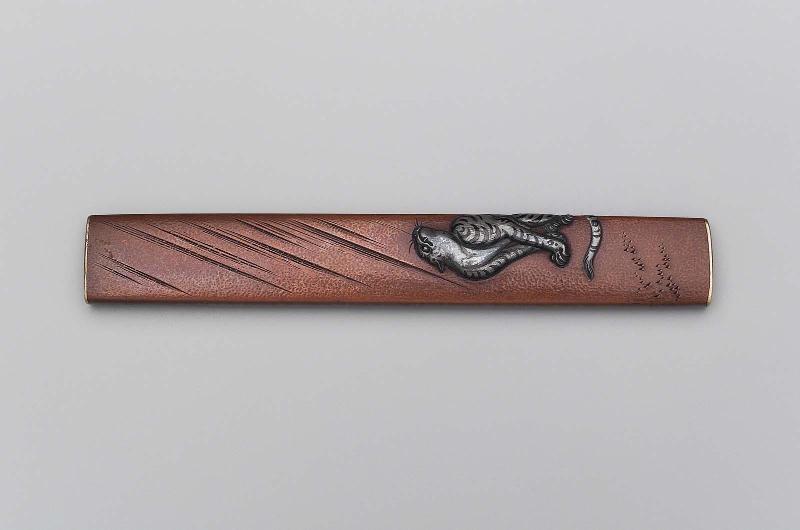 Kozuka with design of a tiger in the rain