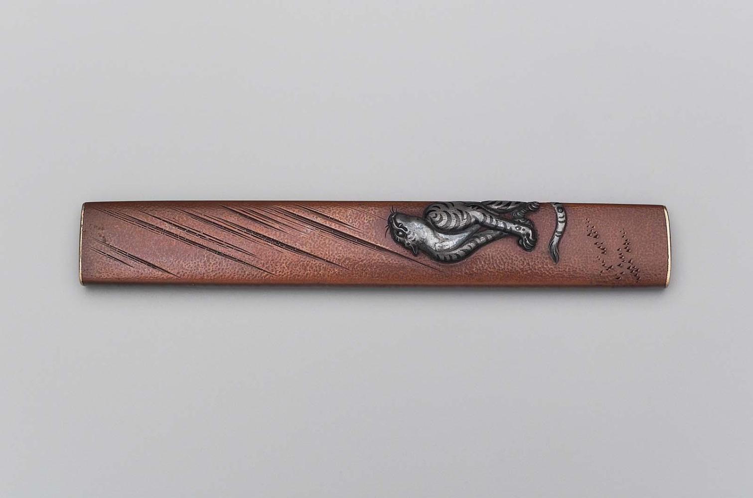 Kozuka with design of a tiger in the rain