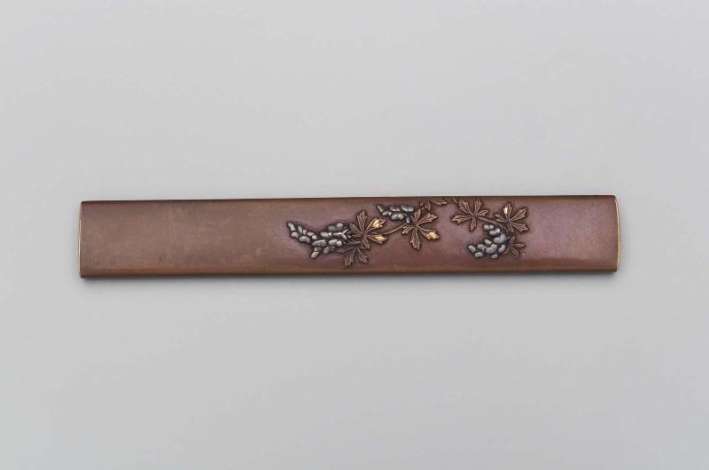 Kozuka with design of a flowering branch