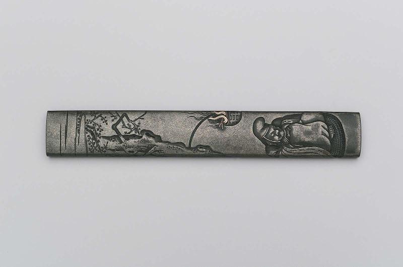 Kozuka with design of sleeping watchman with torch in a tree