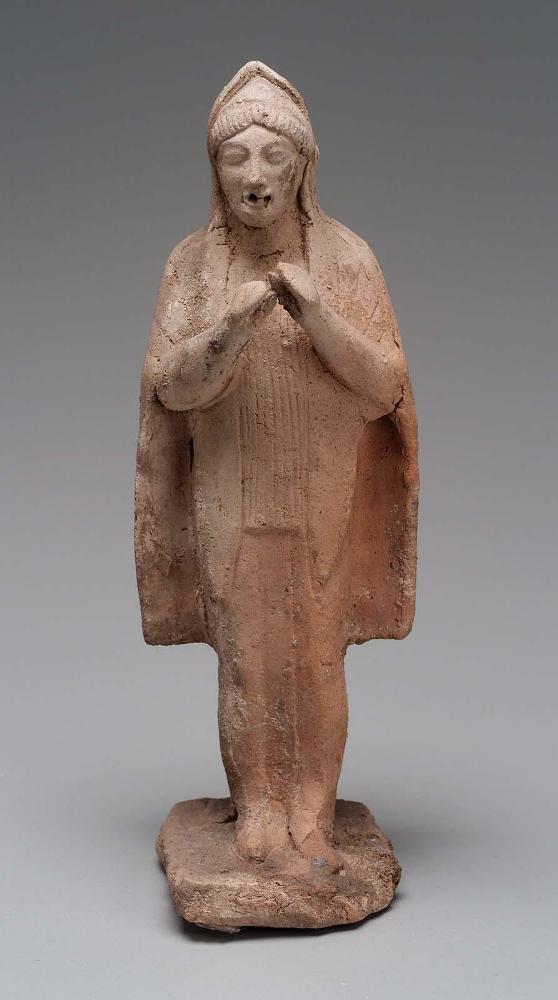 Figurine of standing flute player